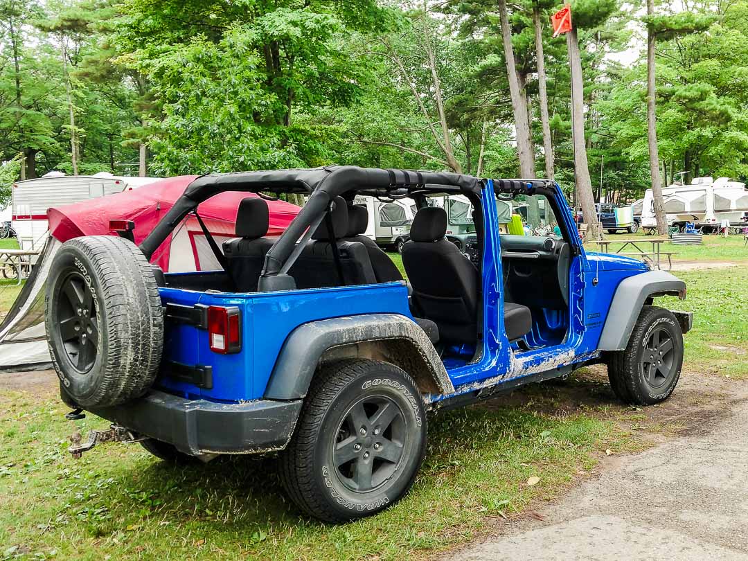 2015 Hydro Blue Jeep Wrangler 4 Door Sport with Doors Off at Silver Lake State Park, Michigan